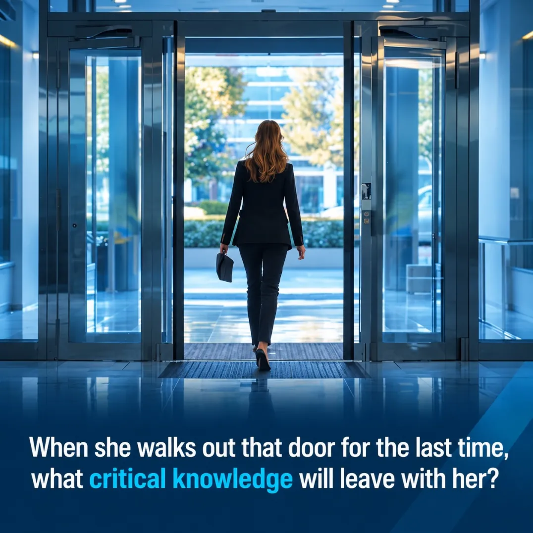 An executive walking out through a revolving office door